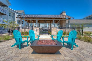 Outdoor fire pit with adirondack chairs